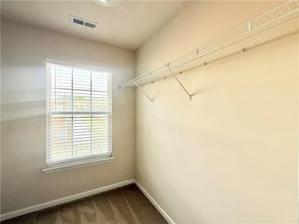 a view of a room with a window and a shower