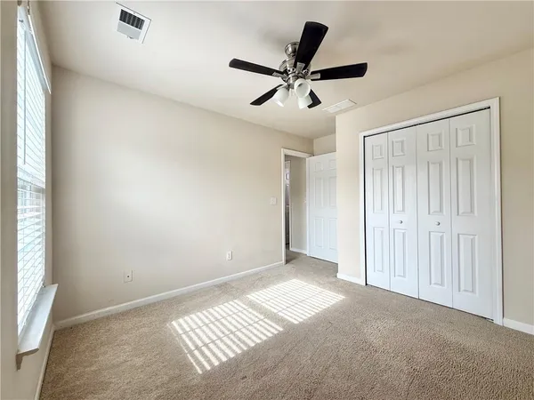 a balcony with view of trees in the background