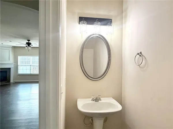 a bathroom with a sink a mirror and a toilet