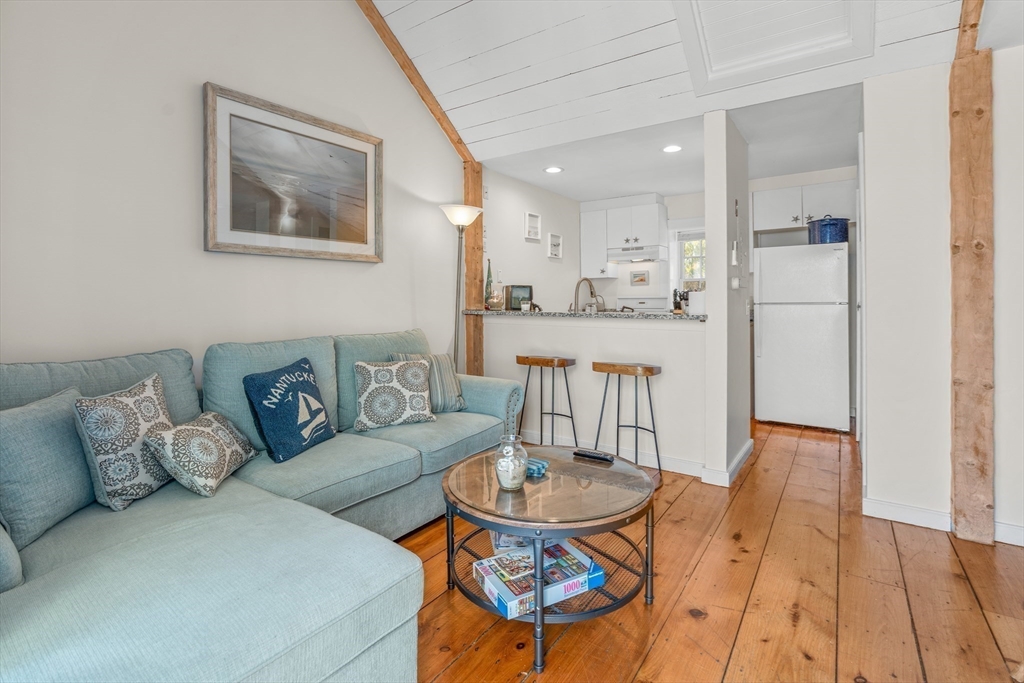 6 Hammock Pond Road, Unit 6 Mashpee, MA 02649 - Photo 11 of 31 a living room with furniture and wooden floor