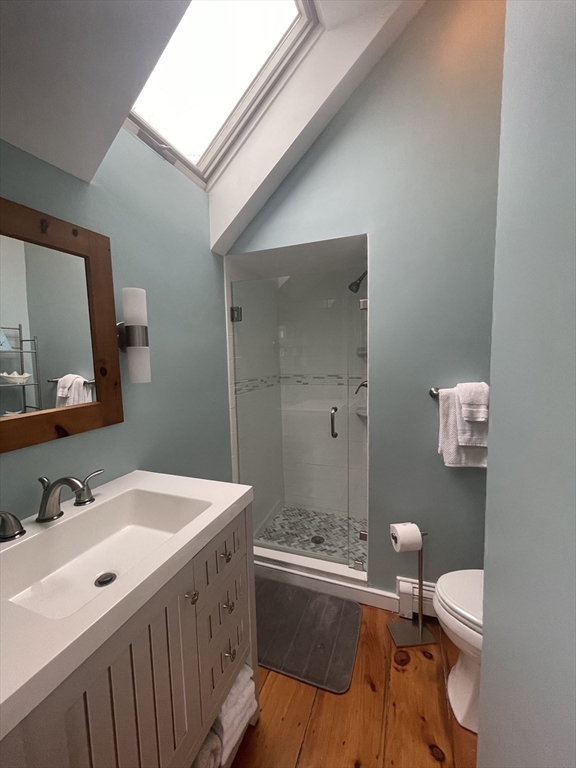 6 Hammock Pond Road, Unit 6 Mashpee, MA 02649 - Photo 22 of 31 a bathroom with a sink a toilet and shower