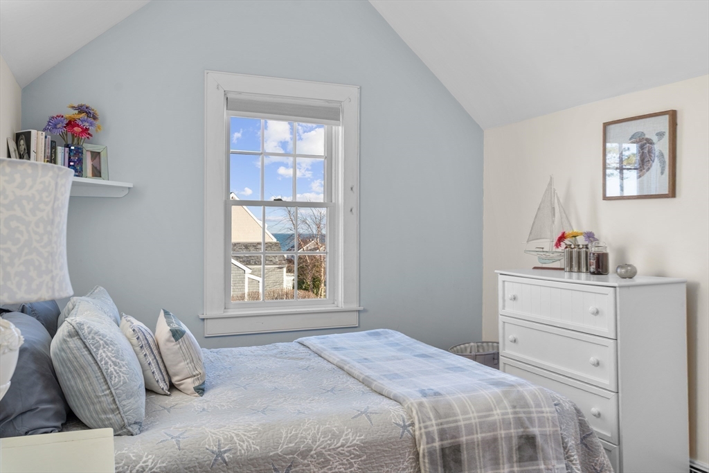 6 Hammock Pond Road, Unit 6 Mashpee, MA 02649 - Photo 23 of 31 a bedroom with a bed and a window