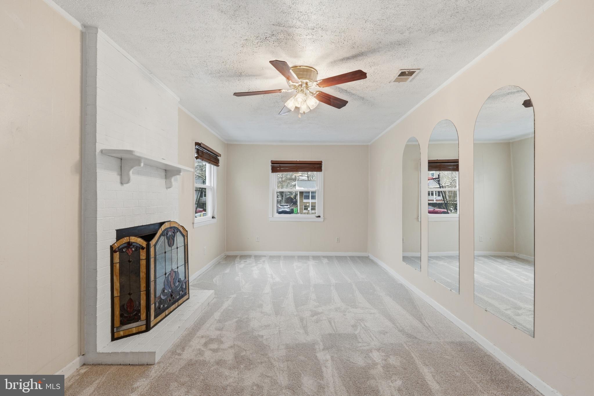 112 North Kennedy Road Sterling, VA 20164 - Photo 12 of 39 a view of a livingroom with a couch and ceiling fan