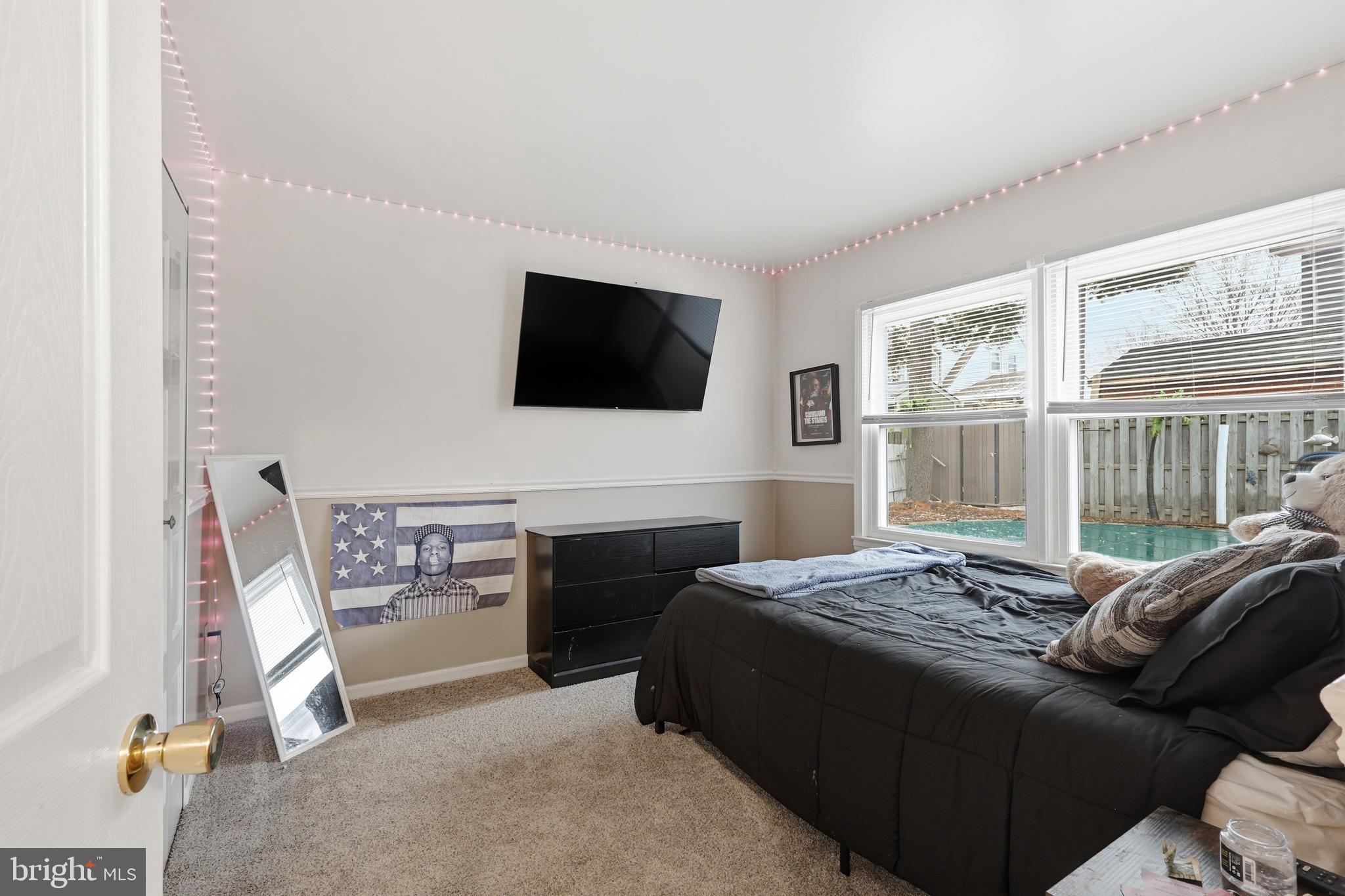112 North Kennedy Road Sterling, VA 20164 - Photo 15 of 39 a bedroom with a bed and a flat screen tv