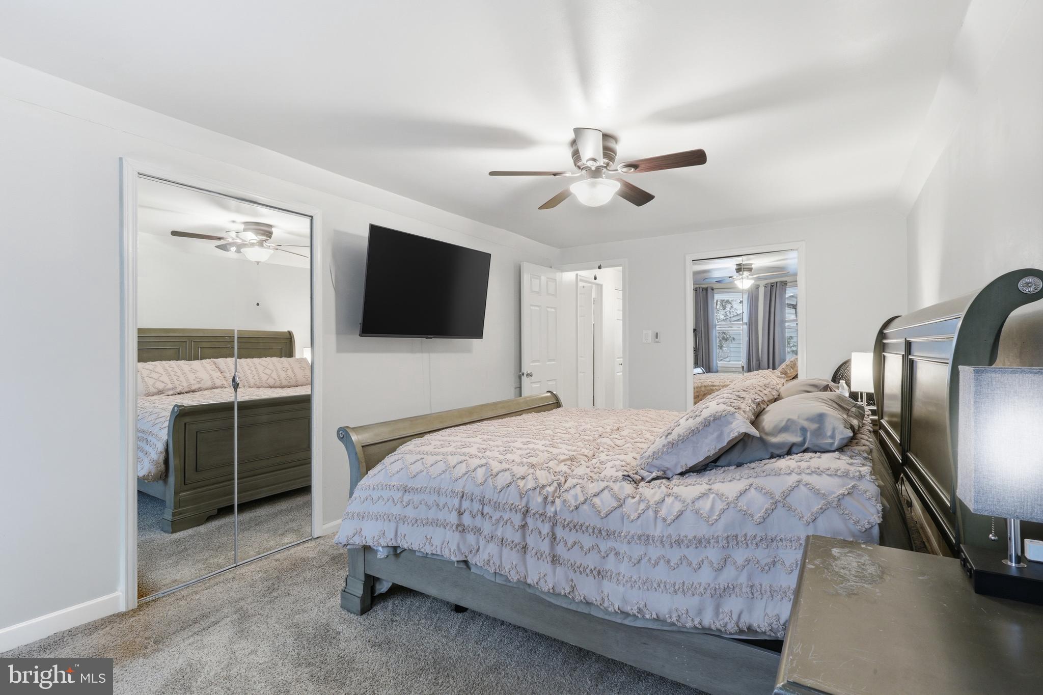 112 North Kennedy Road Sterling, VA 20164 - Photo 19 of 39 a bedroom with a bed and a flat screen tv