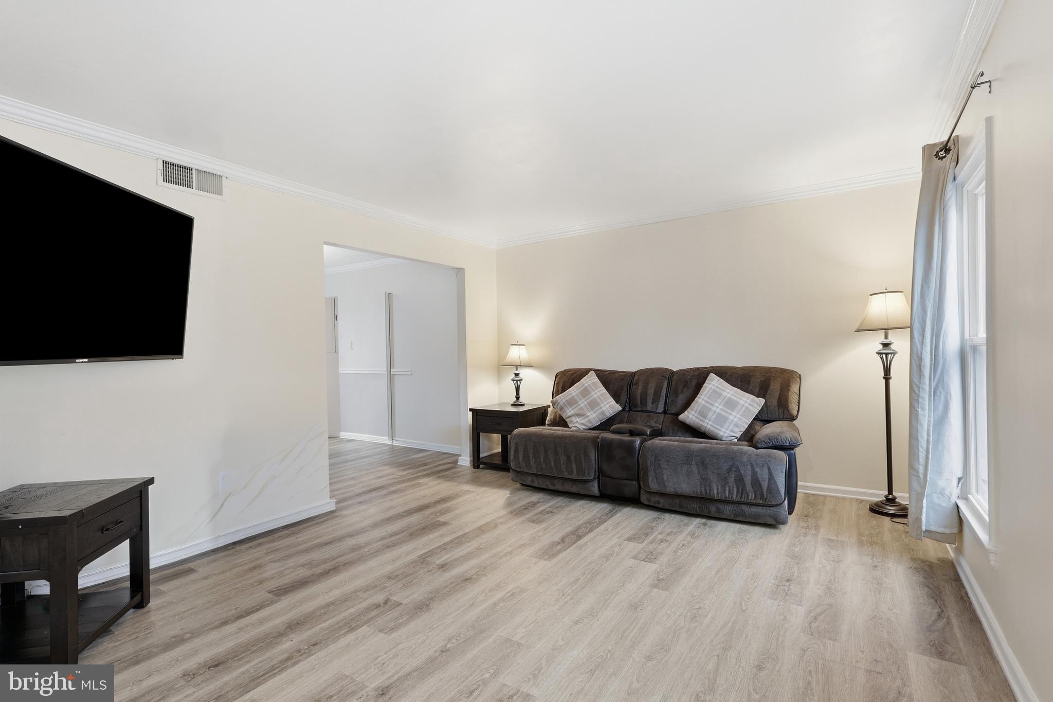 112 North Kennedy Road Sterling, VA 20164 - Photo 5 of 39 a living room with furniture and a flat screen tv
