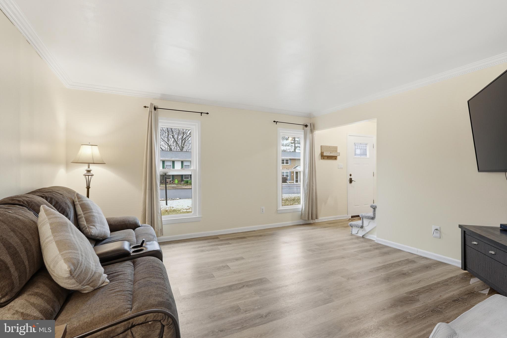 112 North Kennedy Road Sterling, VA 20164 - Photo 6 of 39 a living room with furniture and a flat screen tv
