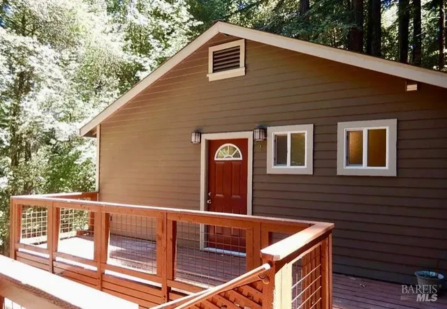 a view of a two chairs and table in the balcony