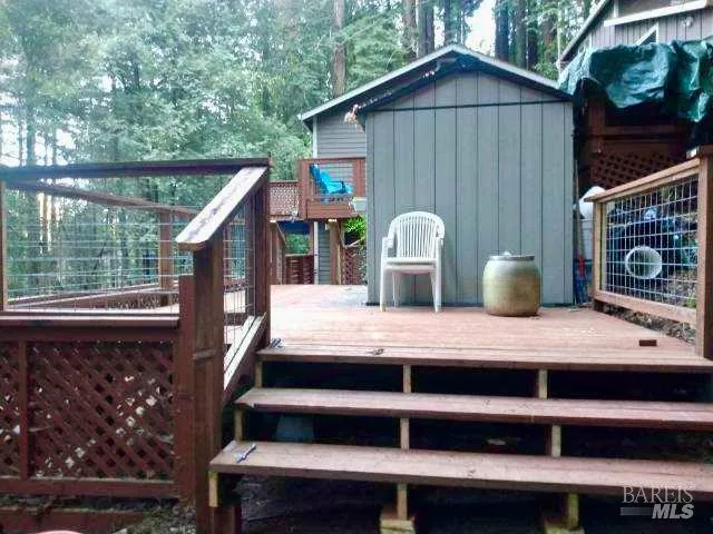 a view of a house with backyard and porch