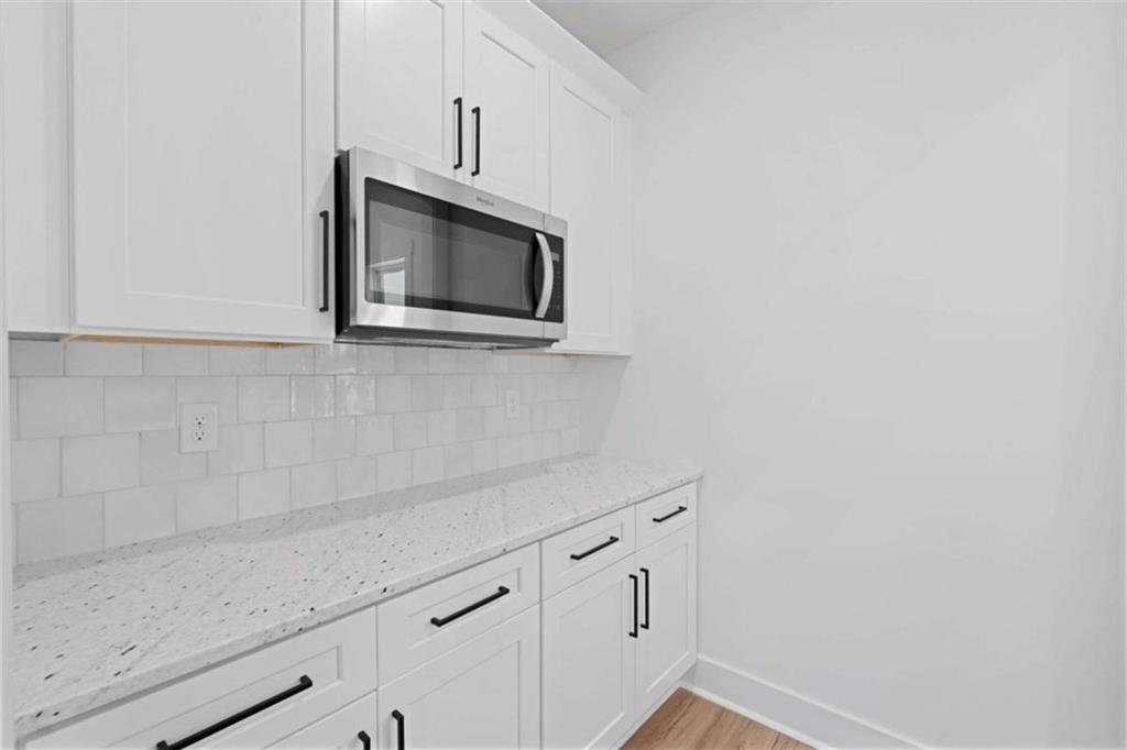 11691 Hazelbrand Road Northeast Covington, GA 30014 - Photo 16 of 53 a microwave and cabinets