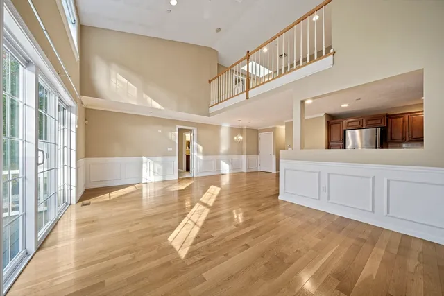 a view of a hallway with dining area