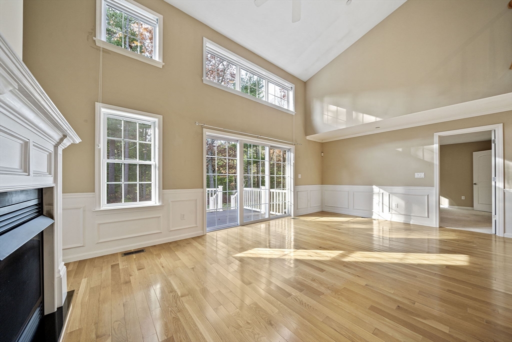14 Red Pony Path, Unit 14 Marshfield, MA 02050 - Photo 13 of 40 a view of an empty room with wooden floor and a window