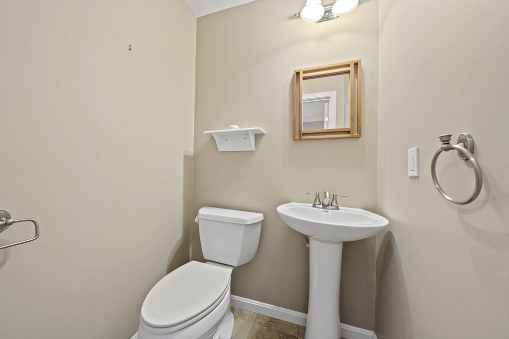 14 Red Pony Path, Unit 14 Marshfield, MA 02050 - Photo 15 of 40 a bathroom with a toilet sink and mirror