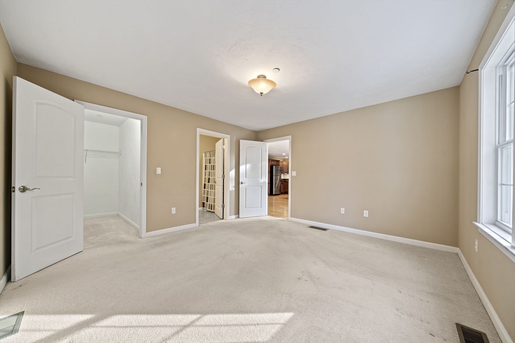 14 Red Pony Path, Unit 14 Marshfield, MA 02050 - Photo 18 of 40 a view of an empty room with a window