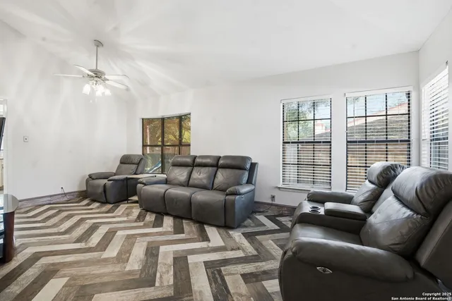 a bedroom with furniture and a window
