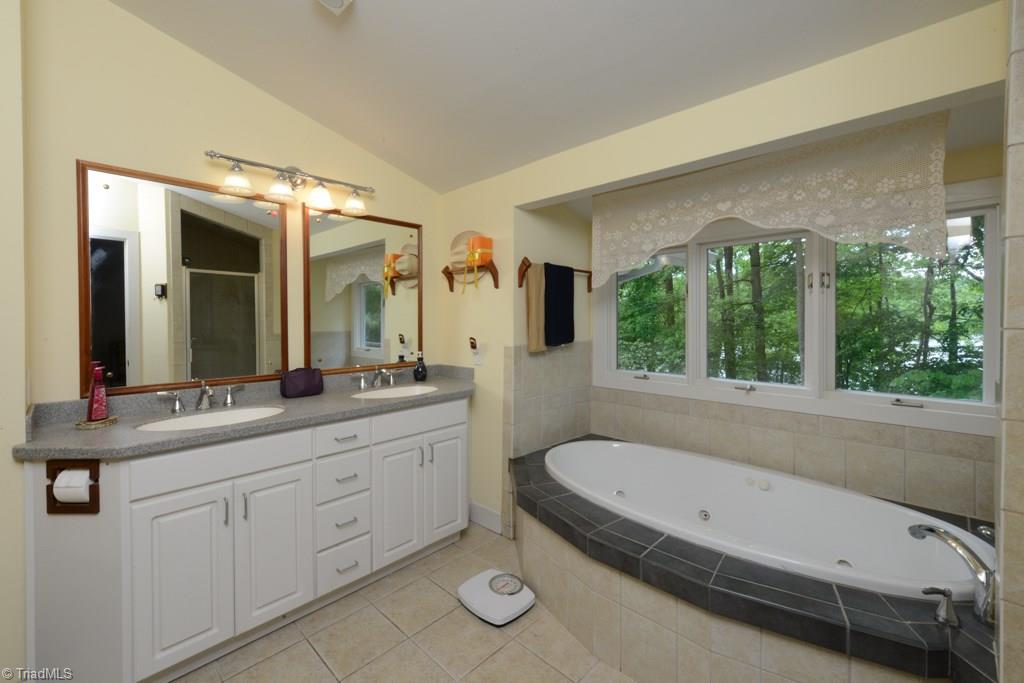 509 Mendenhall Road Jamestown, NC 27282 - Photo 22 of 29 Main level master bath with jetted tub and lake view