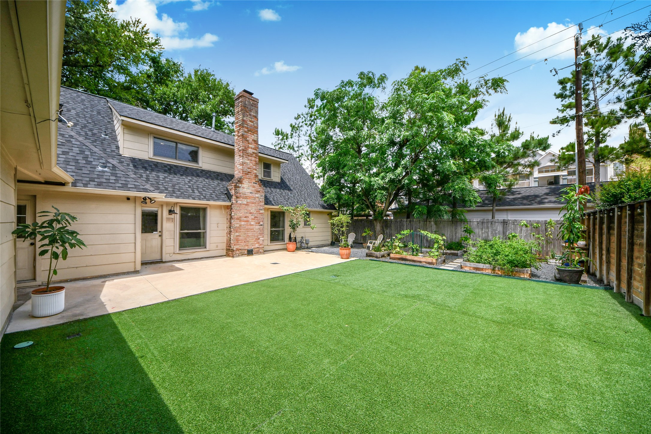 3030 Bernadette Lane Houston, TX 77043 - Photo 25 of 31 a front view of a house with a garden and plants