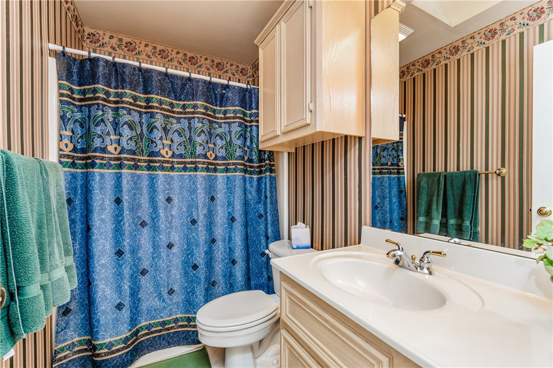 7306 Sun Valley Drive Corpus Christi, TX 78413 - Photo 31 of 40 a bathroom with a sink a toilet and shower