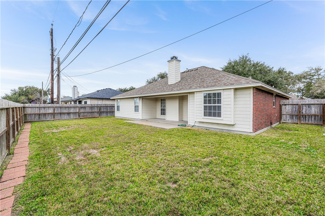 7306 Sun Valley Drive Corpus Christi, TX 78413 - Photo 34 of 40 a front view of a house with garden