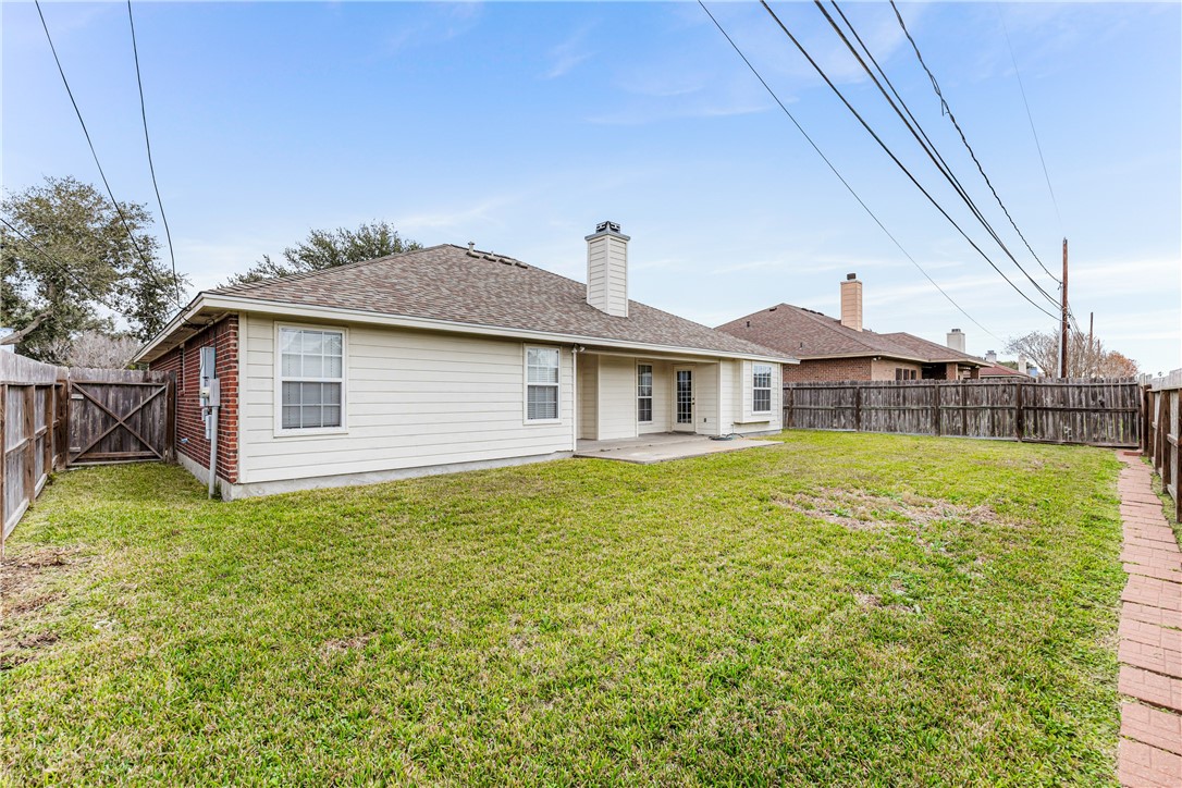 7306 Sun Valley Drive Corpus Christi, TX 78413 - Photo 35 of 40 a front view of a house with garden