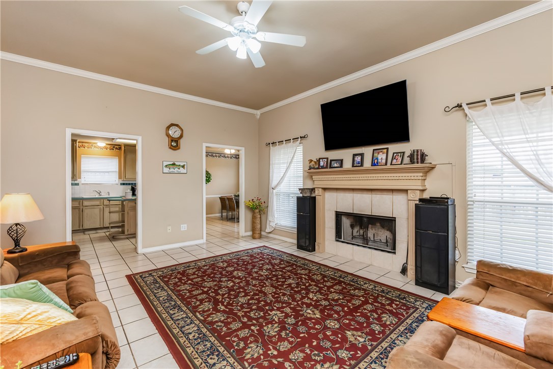 7306 Sun Valley Drive Corpus Christi, TX 78413 - Photo 6 of 40 a living room with a flat screen tv and a fireplace