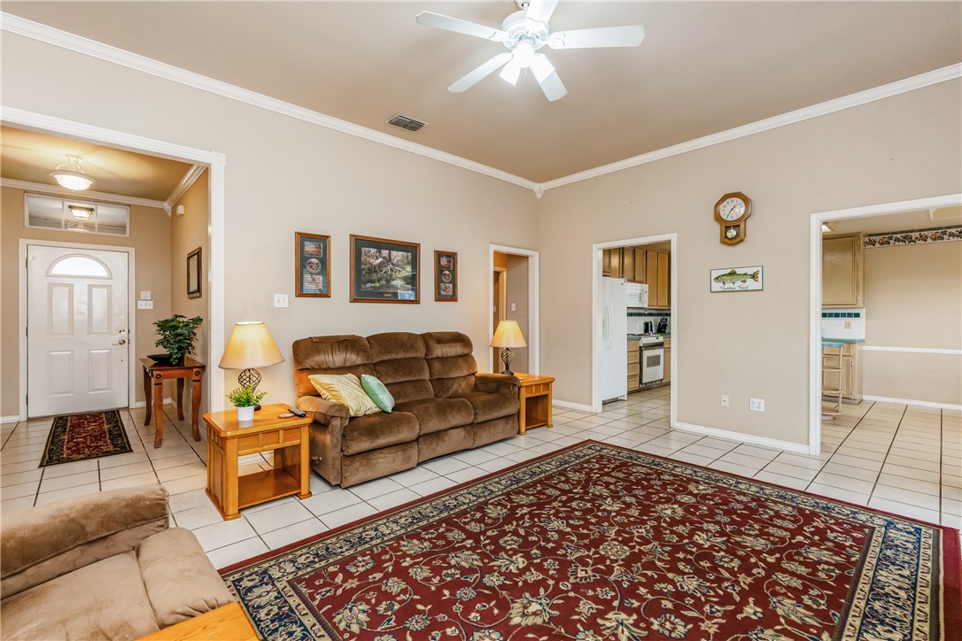 7306 Sun Valley Drive Corpus Christi, TX 78413 - Photo 7 of 40 a living room with furniture and a rug