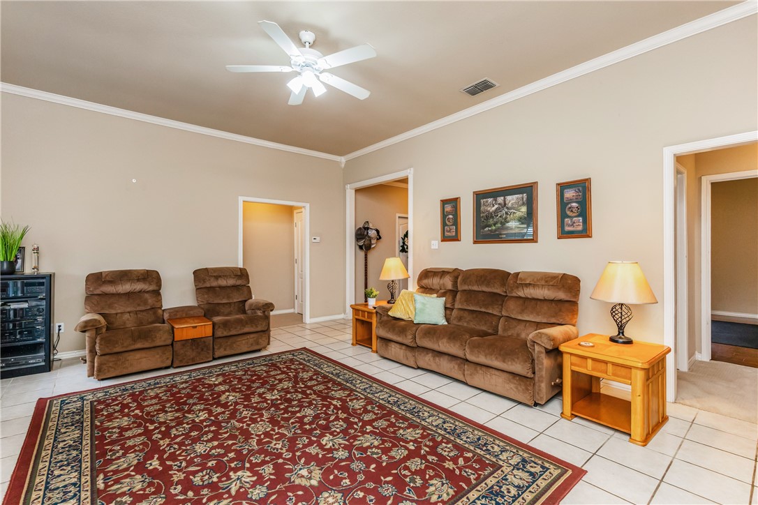 7306 Sun Valley Drive Corpus Christi, TX 78413 - Photo 8 of 40 a living room with furniture and a rug