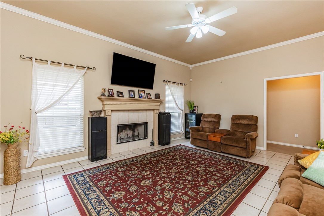 7306 Sun Valley Drive Corpus Christi, TX 78413 - Photo 9 of 40 a living room with furniture and a fireplace