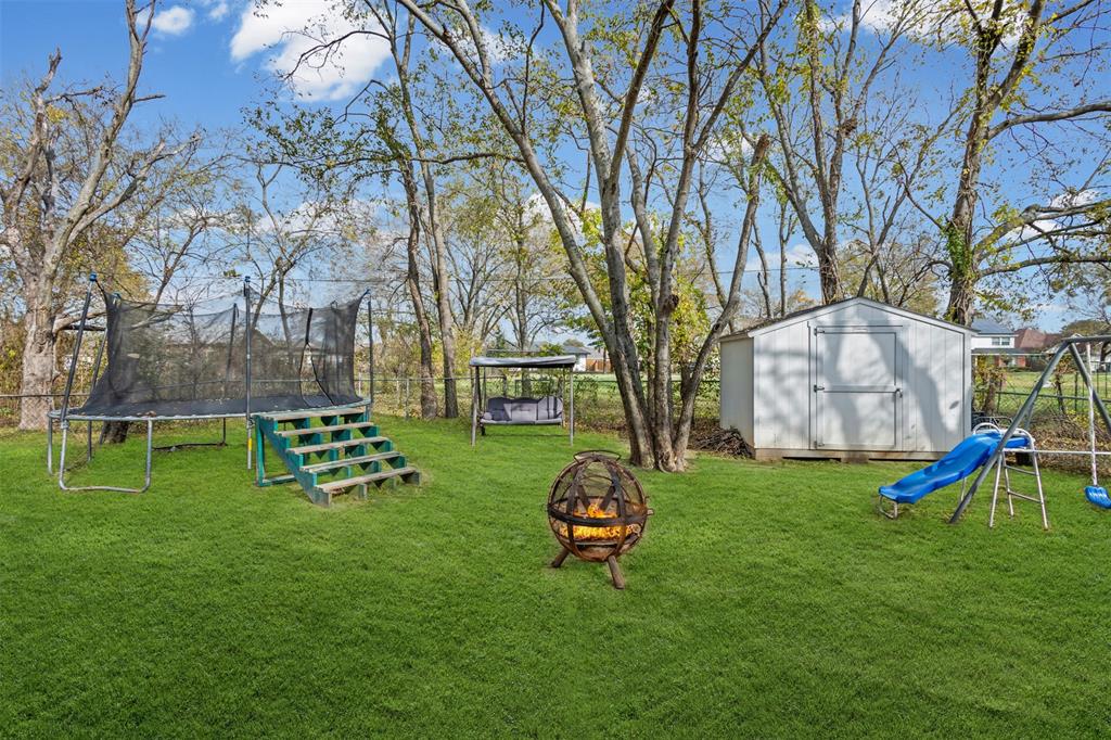 2002 Northeast Main Street Ennis, TX 75119 - Photo 15 of 30 a view of a park with large trees