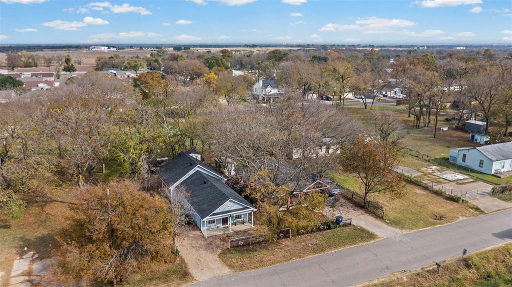 2002 Northeast Main Street Ennis, TX 75119 - Photo 17 of 30 an aerial view of a house with a lake view