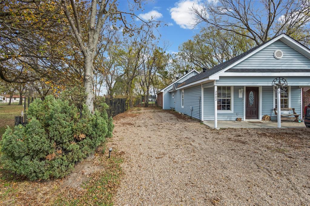 2002 Northeast Main Street Ennis, TX 75119 - Photo 2 of 30 a view of a house with a yard