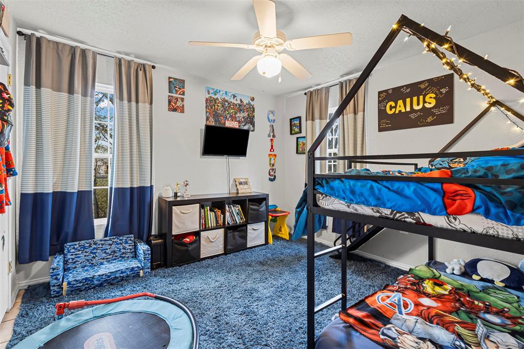 2002 Northeast Main Street Ennis, TX 75119 - Photo 26 of 30 a living room with furniture pool table and flat screen tv