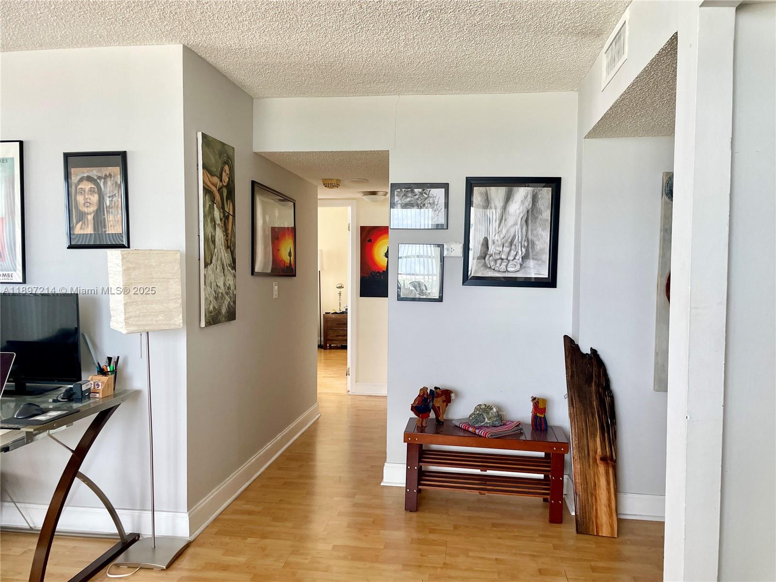 2750 Northeast 183rd Street, Unit 2308 Aventura, FL 33160 - Photo 7 of 19 a living room with furniture and a flat screen tv