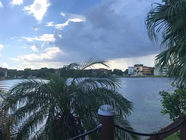 a view of a deck with wooden floor and mountain view