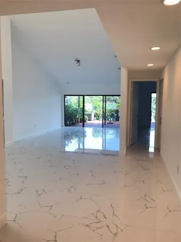 a view of an empty room with a large window