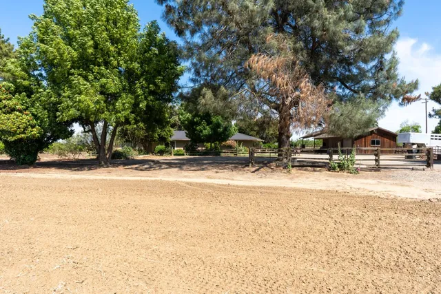 a view of swimming pool with trees