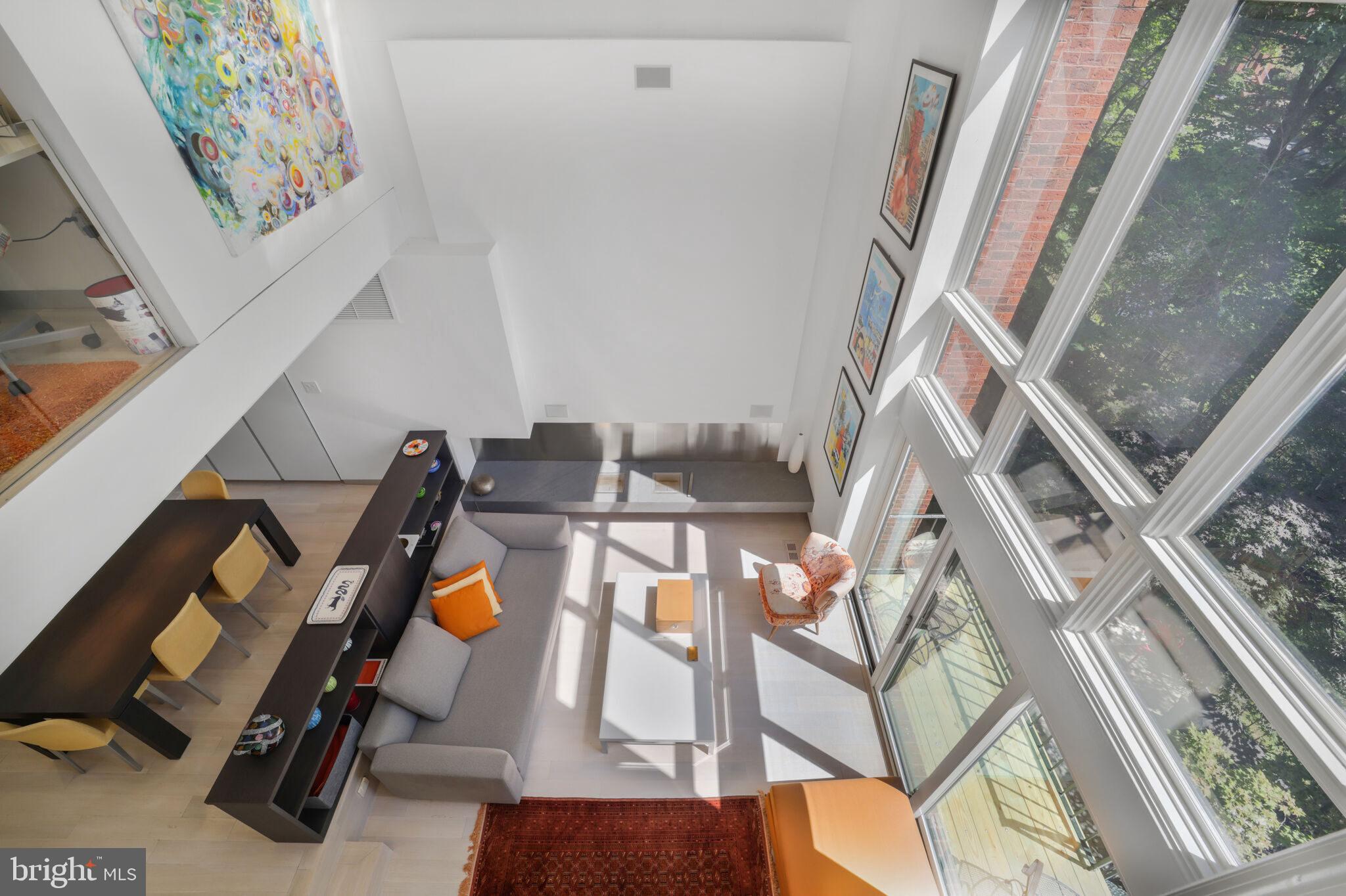 3927 Georgetown Court Northwest Washington, DC 20007 - Photo 13 of 34 wooden floor with windows and white walls