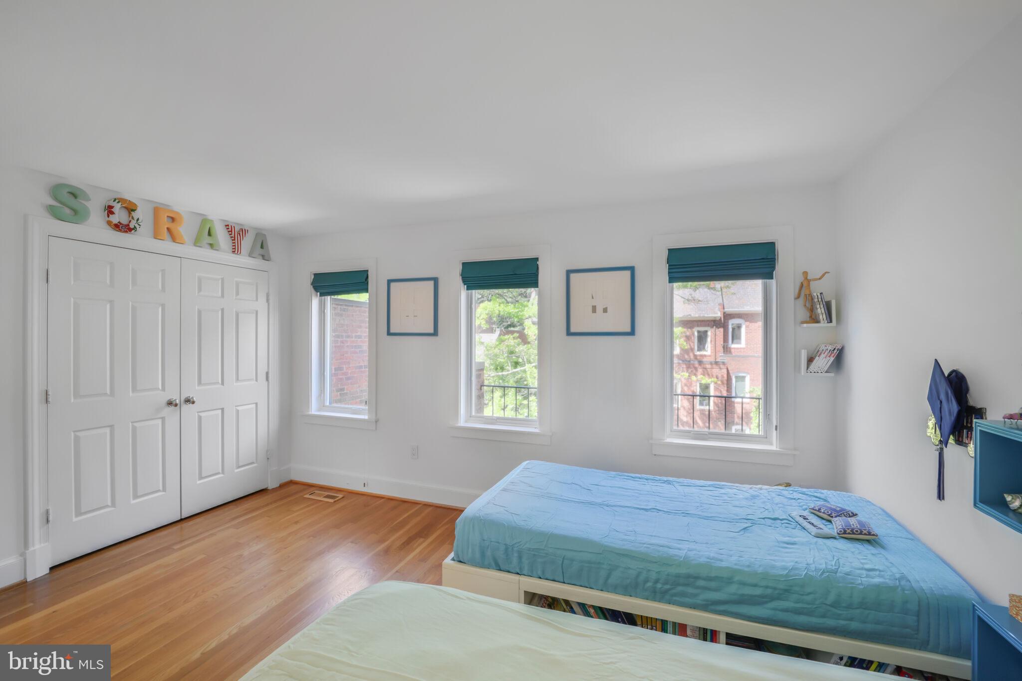3927 Georgetown Court Northwest Washington, DC 20007 - Photo 20 of 34 a bedroom with a bed and a window with wooden floor