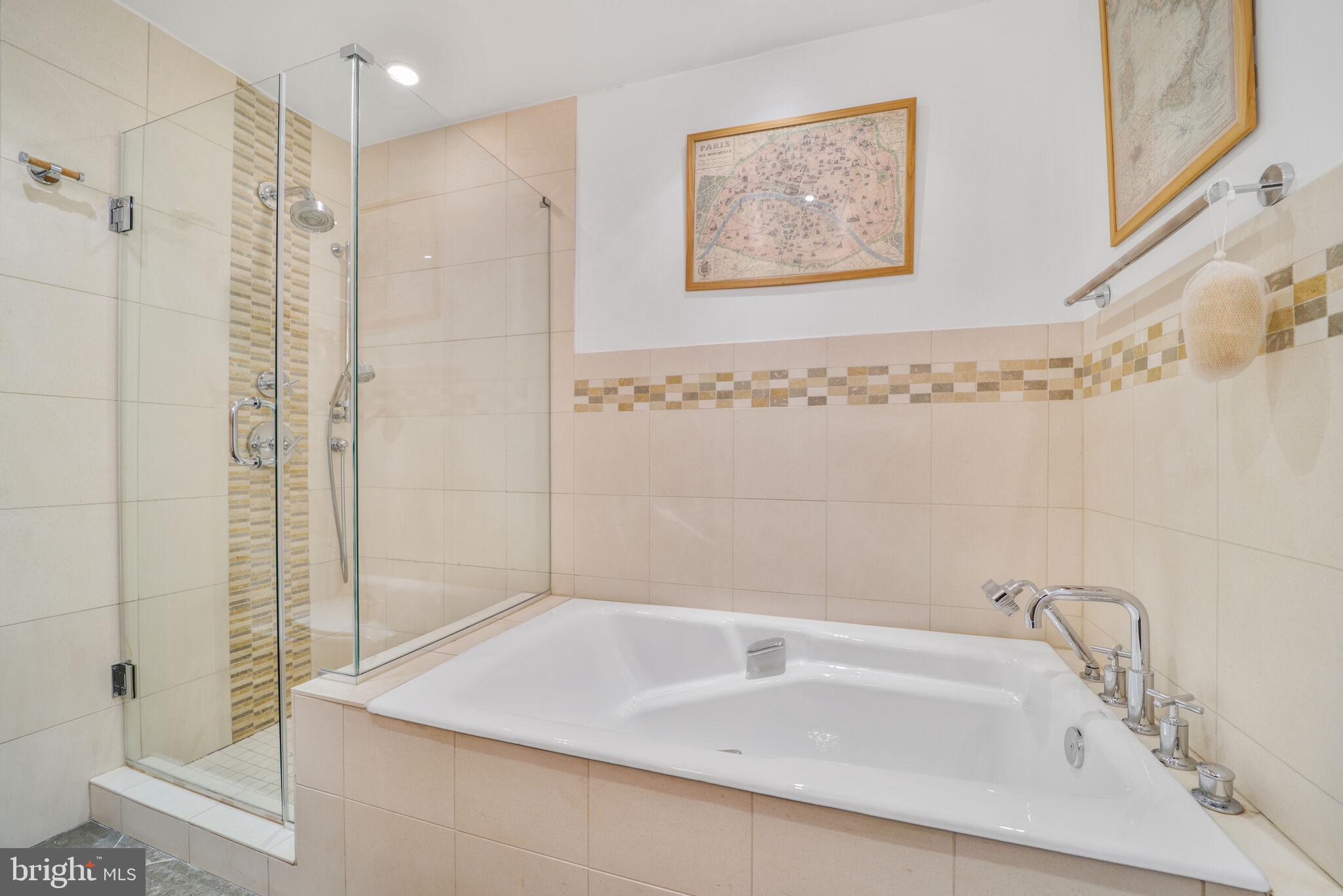 3927 Georgetown Court Northwest Washington, DC 20007 - Photo 22 of 34 a bathroom with a bathtub and shower