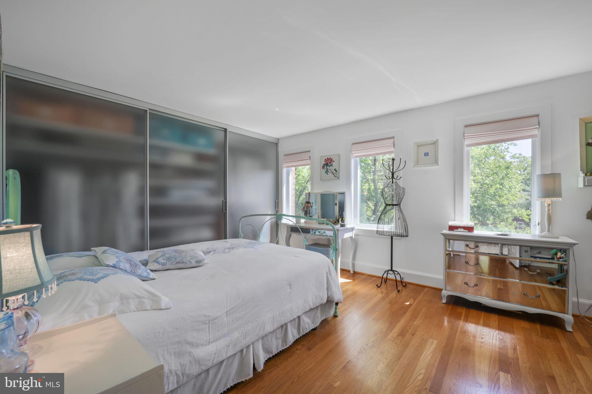 3927 Georgetown Court Northwest Washington, DC 20007 - Photo 23 of 34 a large bedroom with a bed and a large window