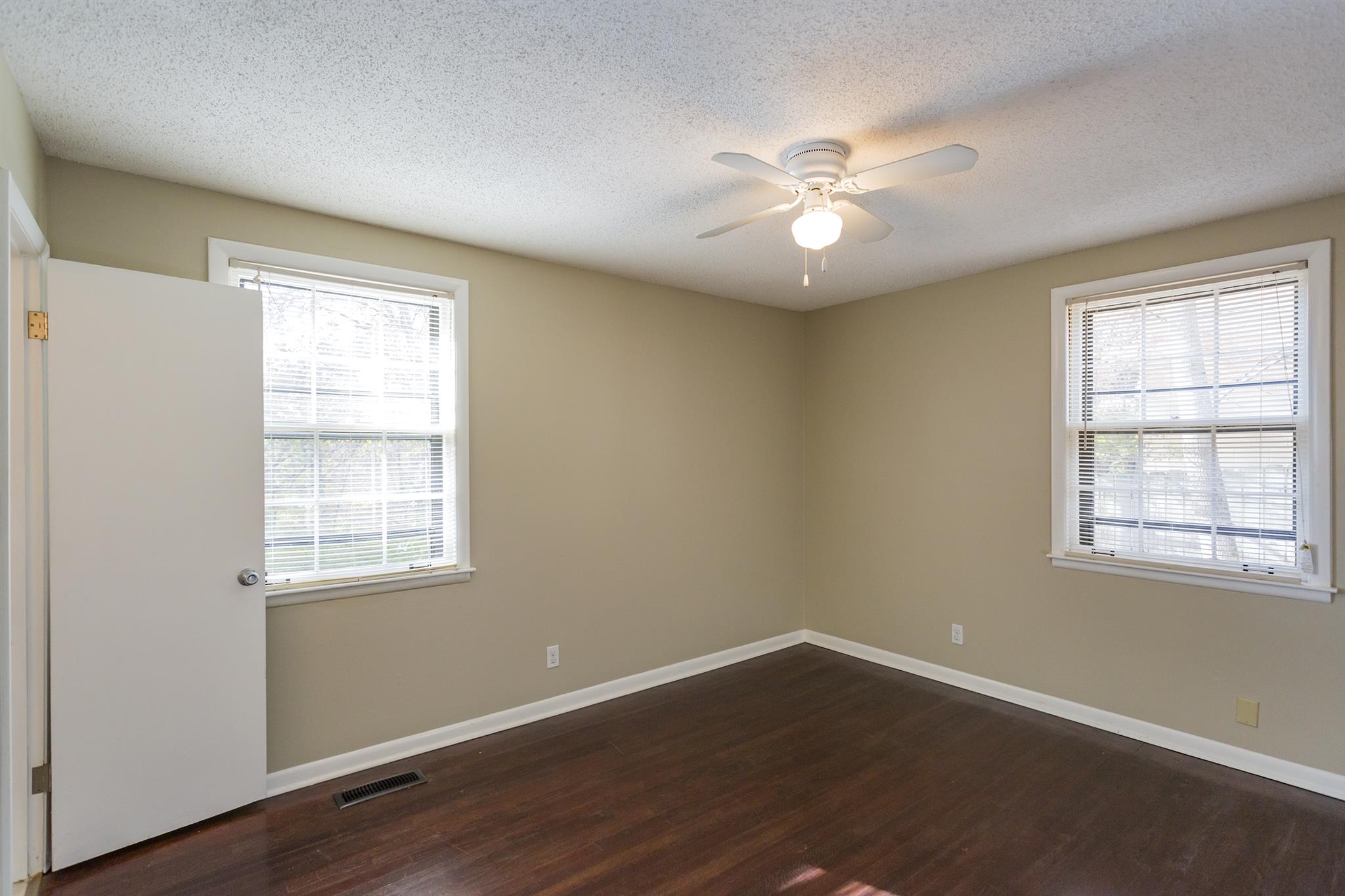 505 Harding Place Nashville, TN 37211 - Photo 16 of 24 a view of an empty room with wooden floor and a window