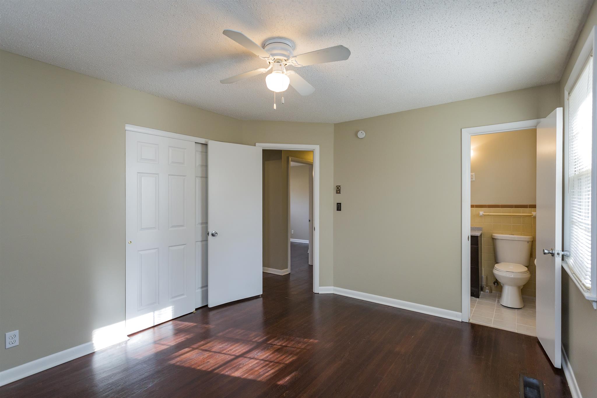 505 Harding Place Nashville, TN 37211 - Photo 17 of 24 an empty room and a bathroom with a toilet