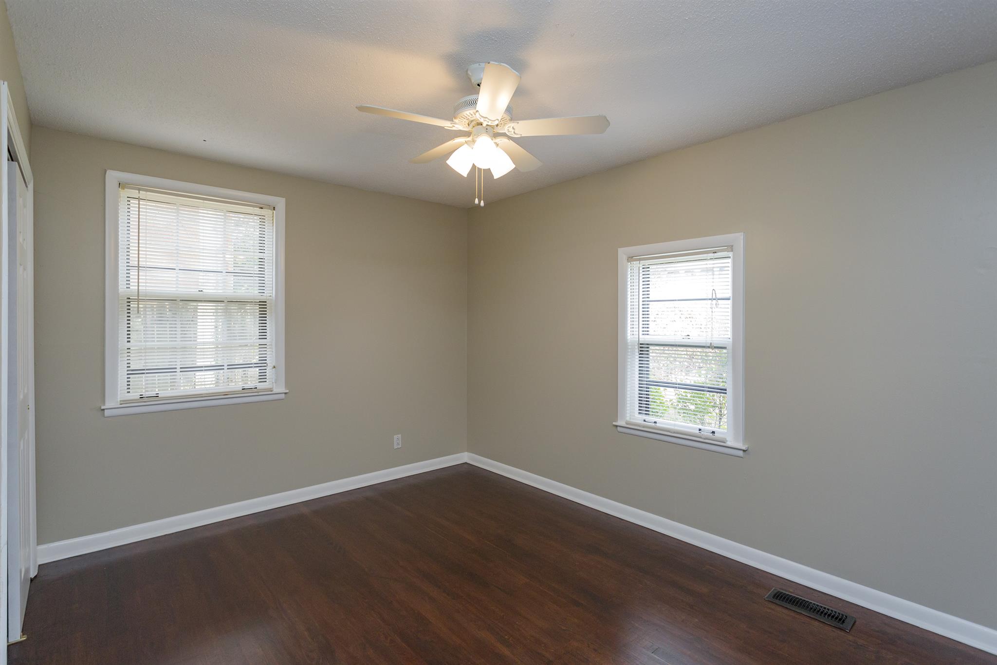 505 Harding Place Nashville, TN 37211 - Photo 19 of 24 a view of an empty room with wooden floor and a window