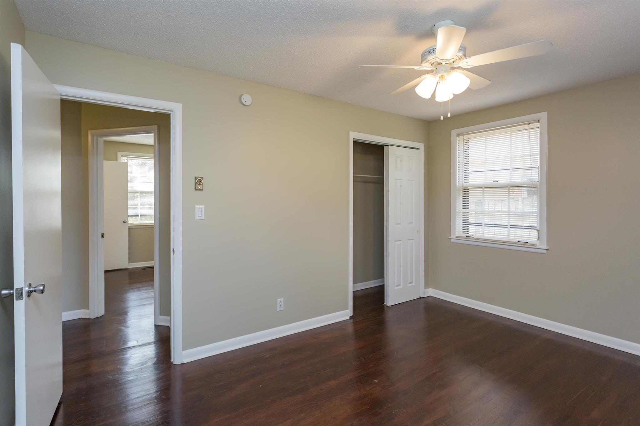 505 Harding Place Nashville, TN 37211 - Photo 20 of 24 a view of an empty room with wooden floor and a window