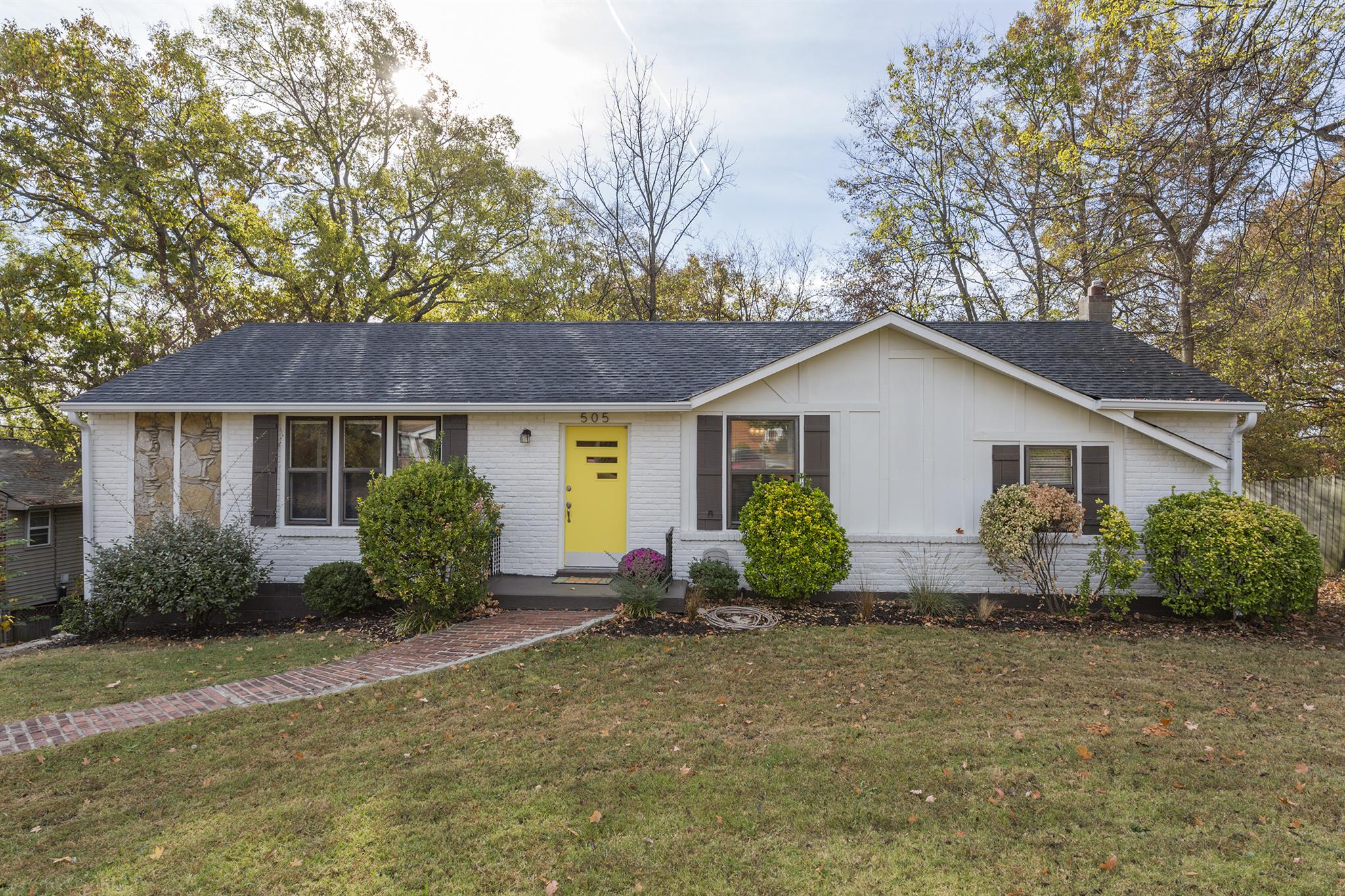 505 Harding Place Nashville, TN 37211 - Photo 2 of 24 a view of a house with backyard and garden