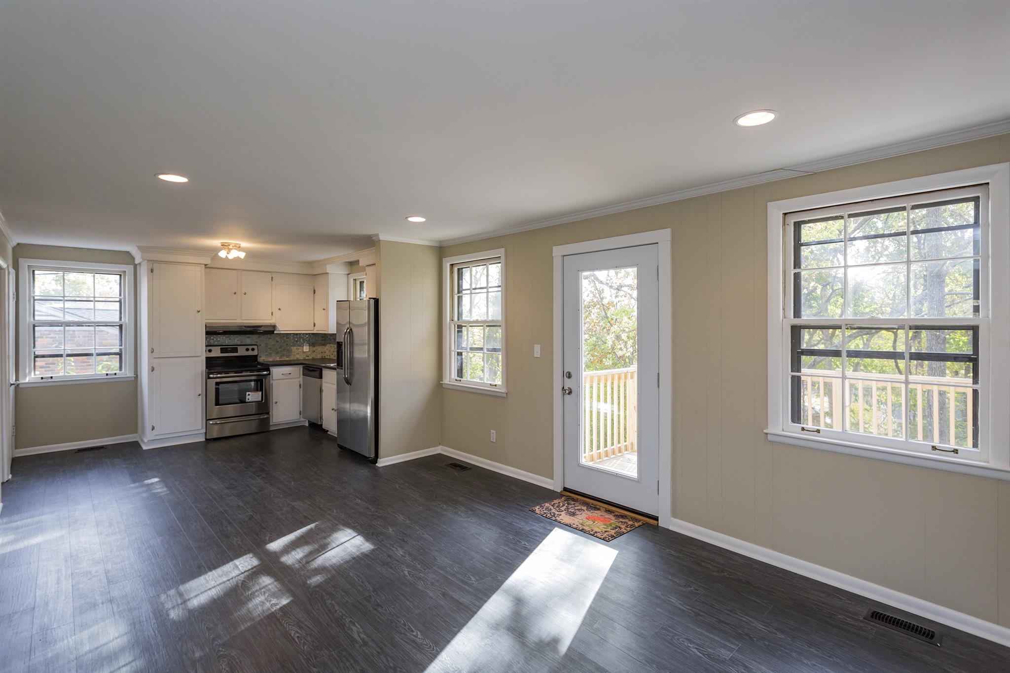 505 Harding Place Nashville, TN 37211 - Photo 8 of 24 a view of an empty room with a window and wooden floor
