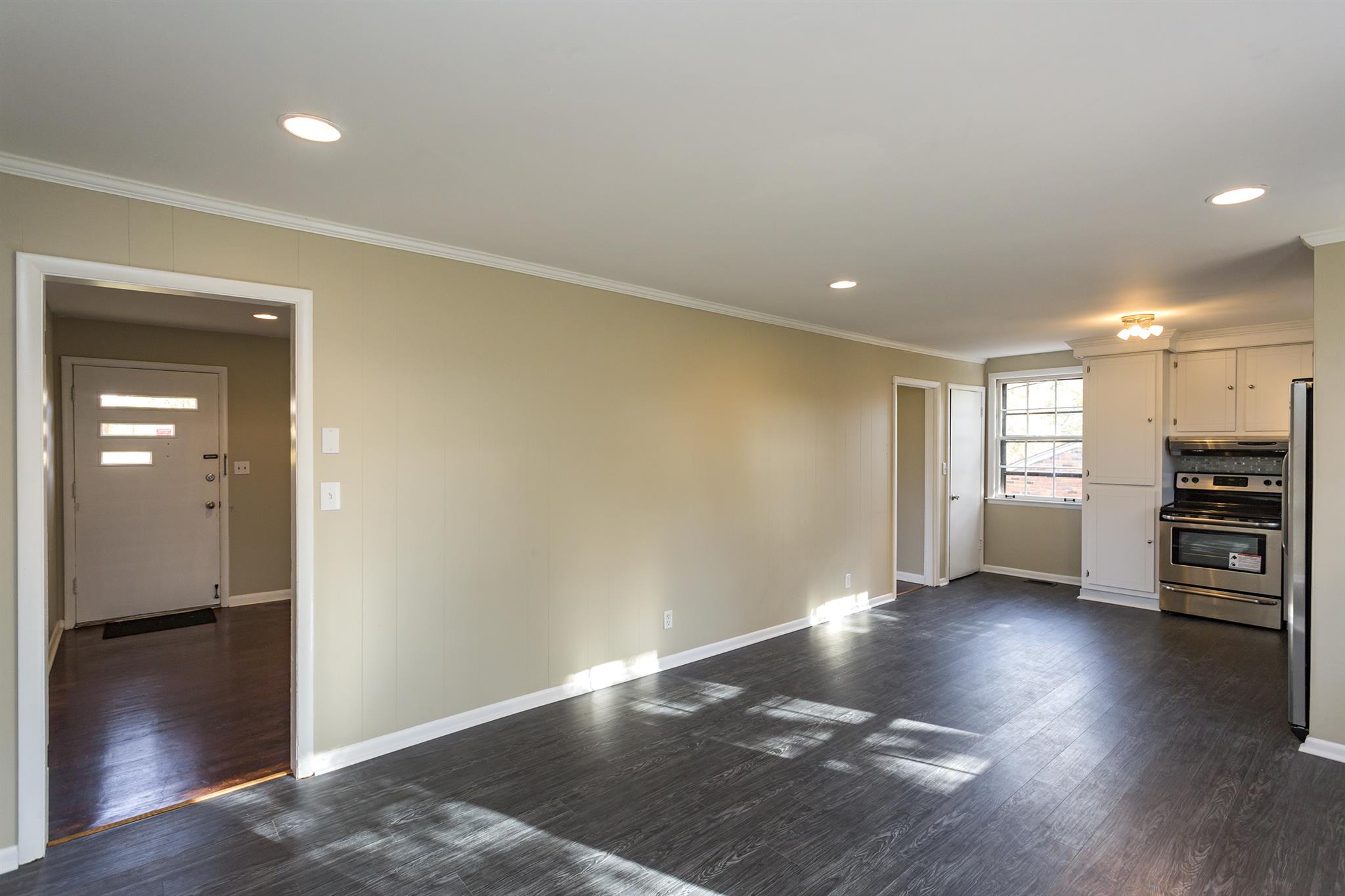 505 Harding Place Nashville, TN 37211 - Photo 9 of 24 an empty room with wooden floor and windows