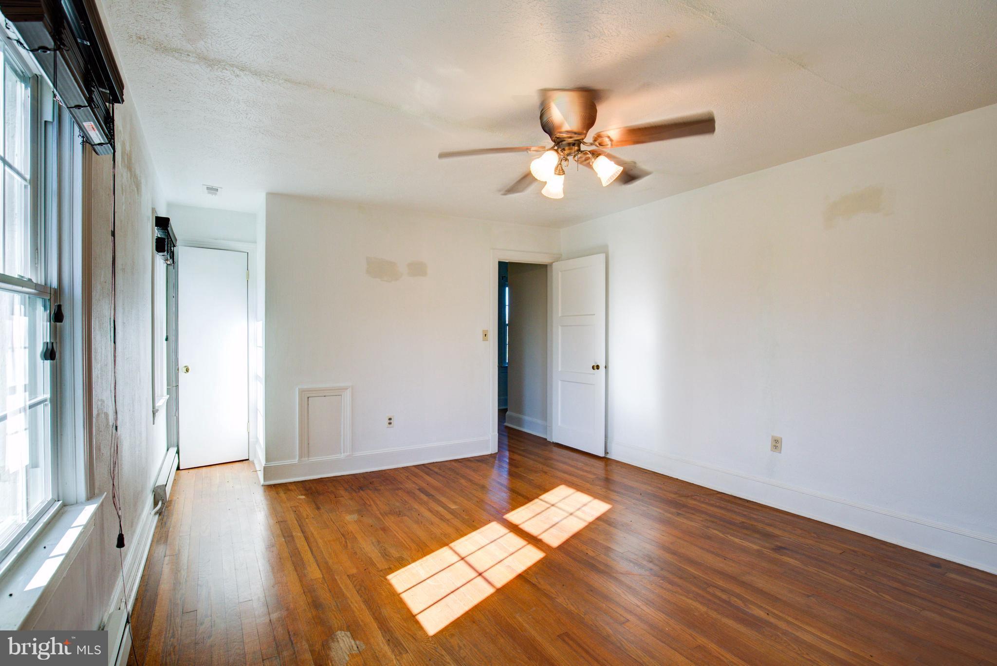 155 Summerville Road Boyce, VA 22620 - Photo 17 of 20 a view of empty room with wooden floor and fan