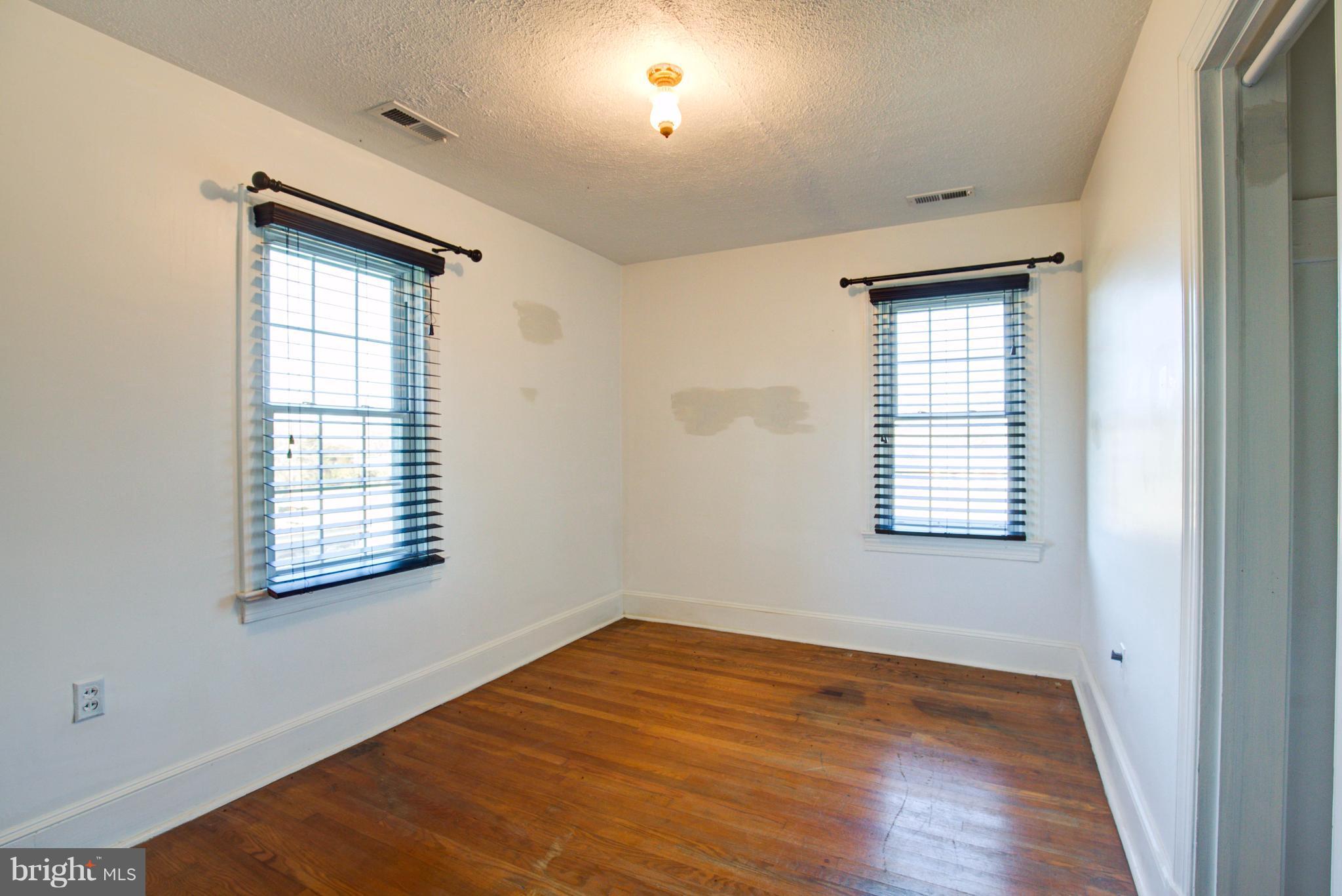155 Summerville Road Boyce, VA 22620 - Photo 19 of 20 a view of an empty room with wooden floor and a window