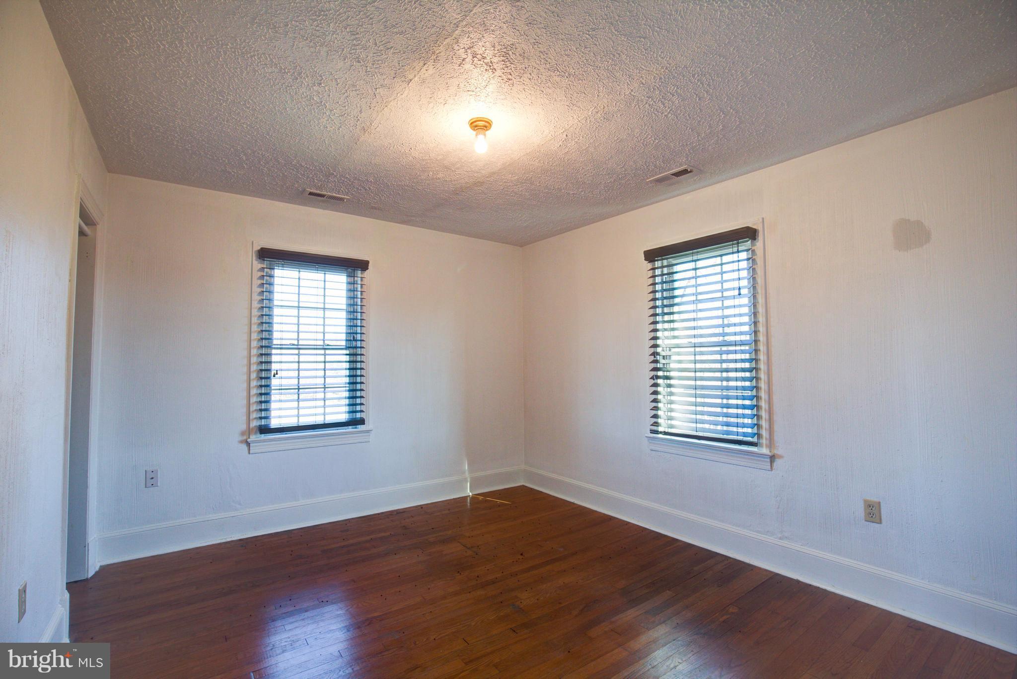 155 Summerville Road Boyce, VA 22620 - Photo 20 of 20 an empty room with wooden floor and windows